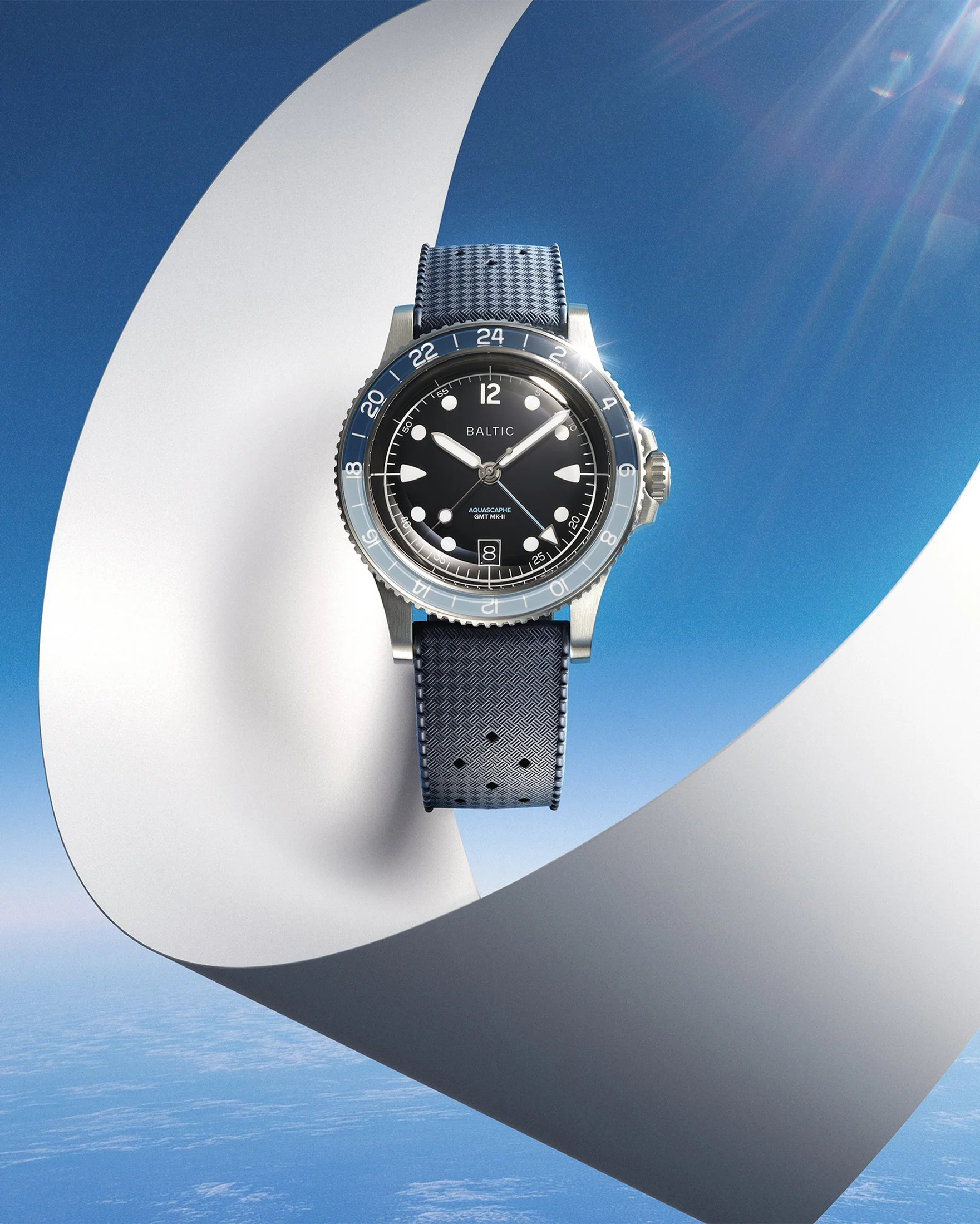 Aquascaphe GMT MK-II Blue on its blue rubber strap. The strap changes the presentation, not the traveller-GMT mechanism. Official Baltic image.