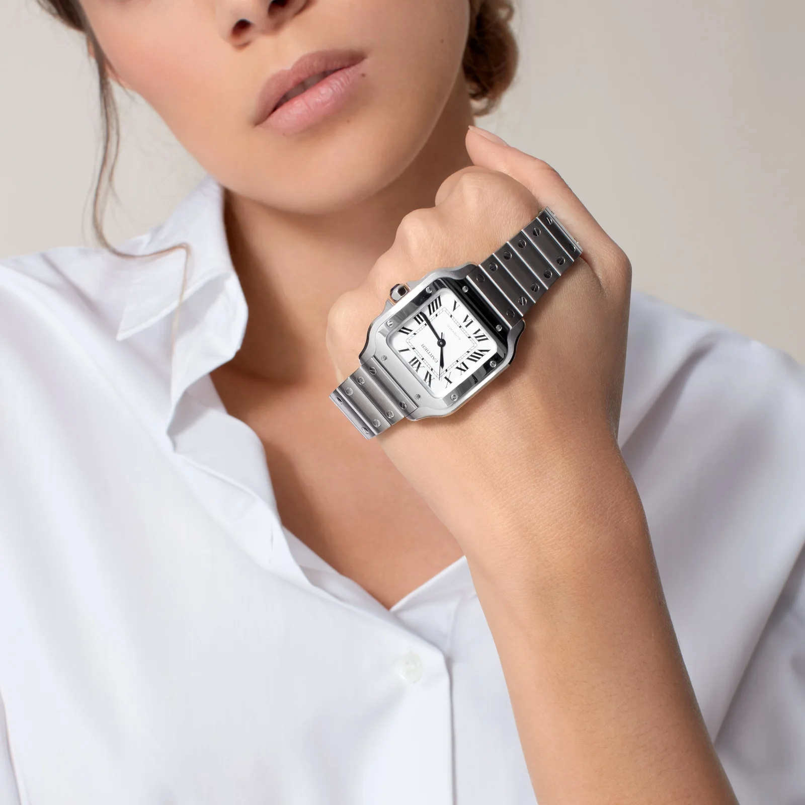 Cartier Santos de Cartier Medium WSSA0029 worn on a wrist in an official lifestyle image