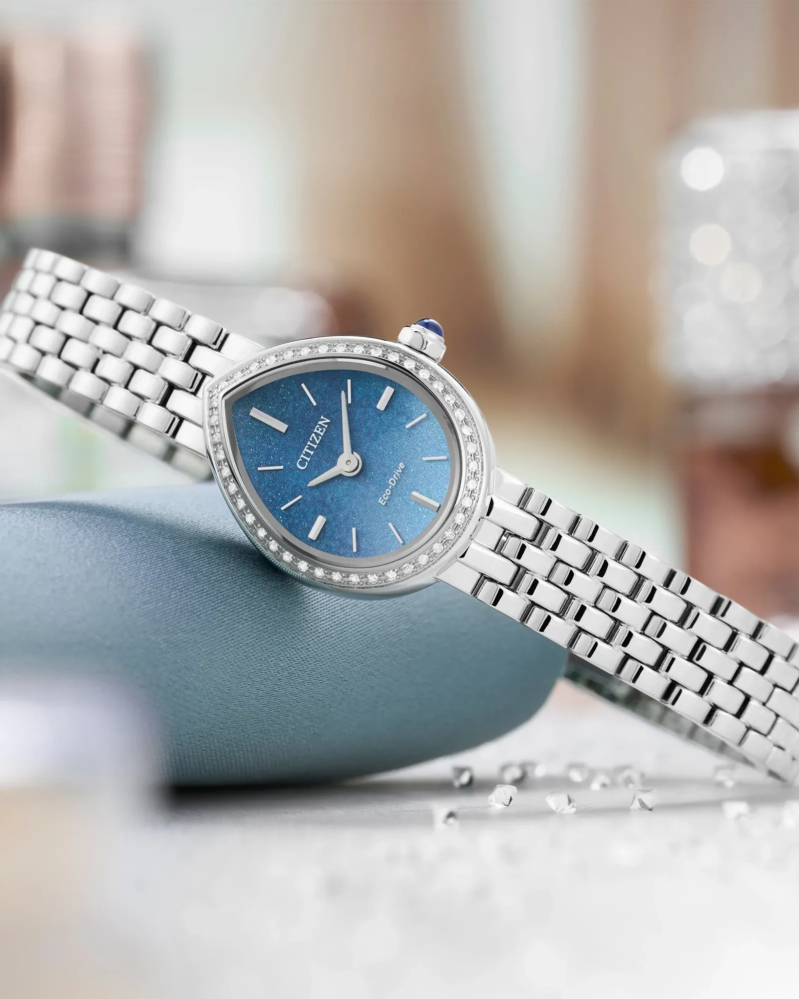Close-up of the Citizen L RAINELL EX1540-58L blue dial, diamond-set case and bracelet.