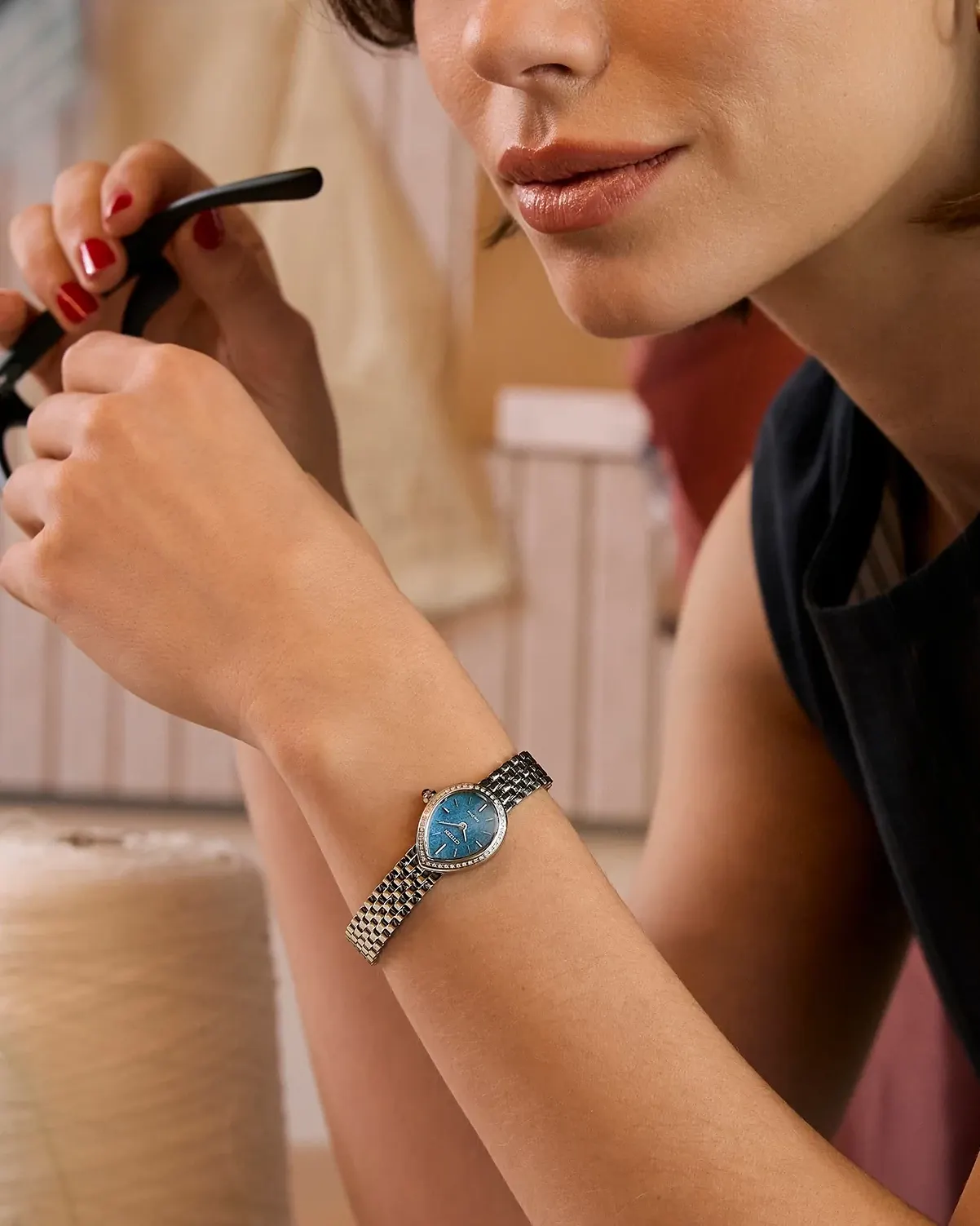 Citizen L RAINELL EX1540-58L worn on the wrist in an official Citizen lifestyle image.