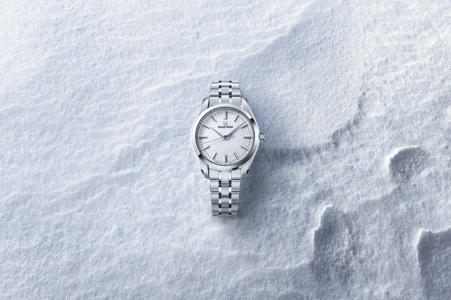 Grand Seiko SBGX359 on a snow-textured official campaign background