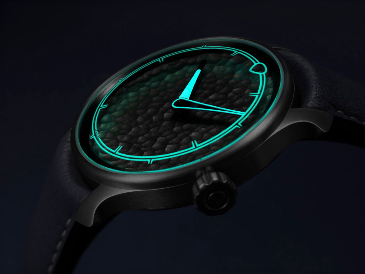 MING 37.06 Royal Selangor lume view with glowing engraved sapphire crystal and hands